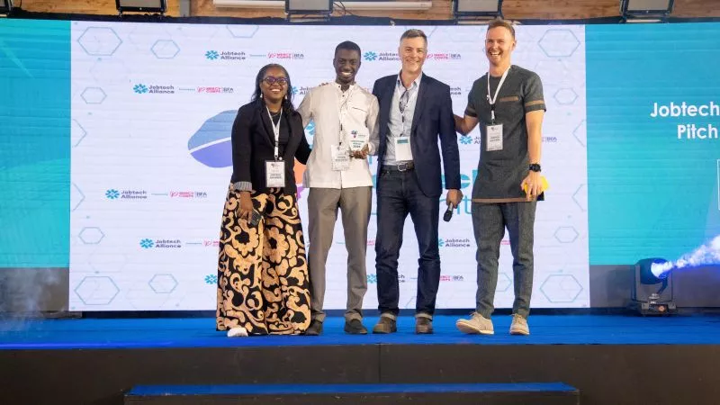 Serigne receiving an award from Jobtech at #AJS2025, Nairobi.